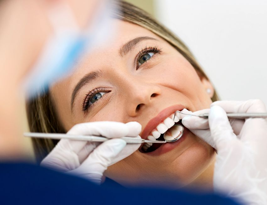 Happy patient with dental crowns