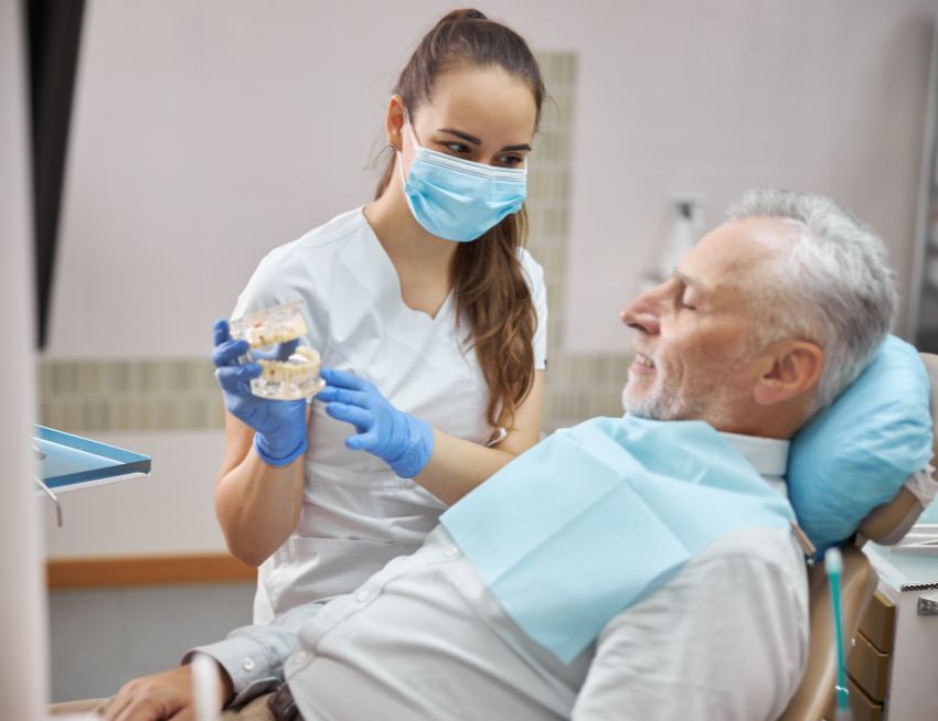 Explaining dental implant procedure