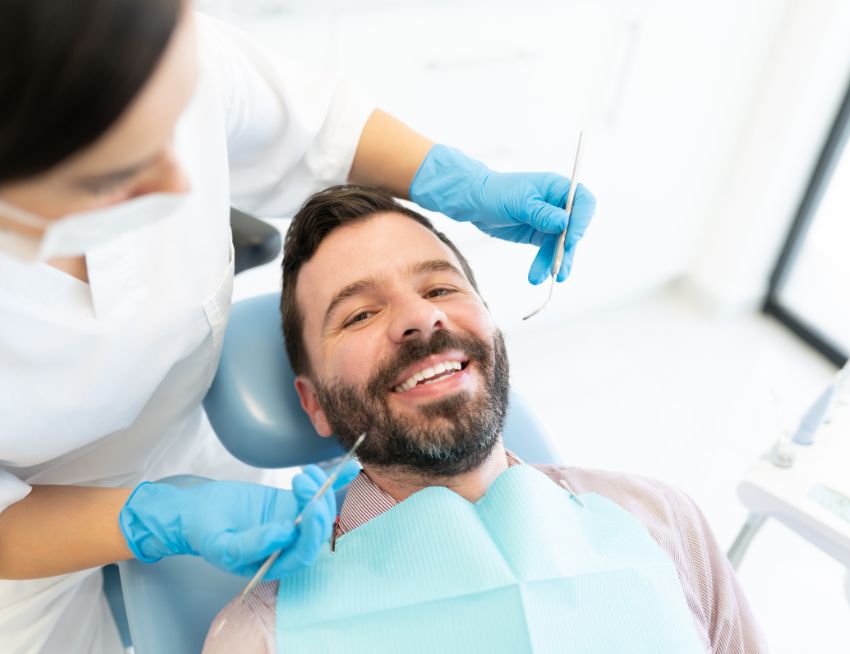 Dental patient with a white smile - front teeth replacement